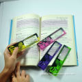 Reading ruler bookmark with magnifier lens